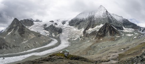Mountain hut Cabane des Dix in front of glacier Glacier de Cheilon and summit Mont Blanc de