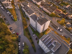 View from above of a town with residential buildings and streets during sunset, Nagold, district of