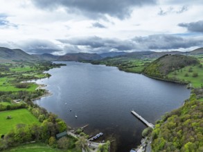Farms and mountains over Ullswater Lake from drone, Pooley Bridge, Lake District National Park,