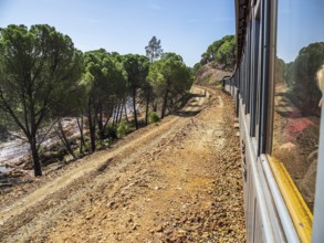 Views the train, touristic railroad line, Rio Tinto mining area, destroyed nature and remains of