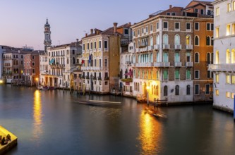 View of the Grand Canal at sunset, picturesque evening mood with illuminated palazzos on the canal