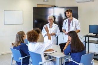 Doctors and nurses participating in a medical conference, sharing insights and expertise for better