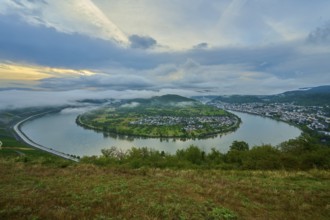 Panoramic view over river and valley, amidst hills in twilight and clouds, summer, Rhine bend