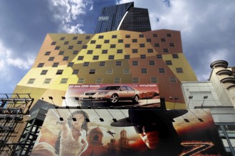 Billboard advertising on the facade of a high-rise building, New York City, USA