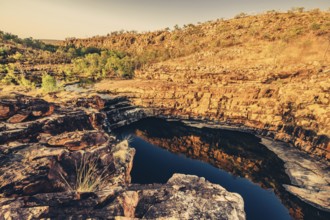 Bell Gorge waterfall, a body of water in north-west Australia in the Kimberley. Sunrise in the