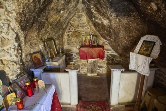 Legend, crab, shell fisherman, sacred interior of a small chapel with icons and candles in a rocky