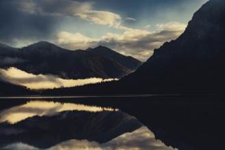 Sunrise with reflections in the Plansee in Tyrol in the Alps in Austria