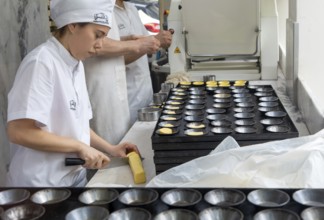 Making Pastel de Nata cakes, Manteigaria coffee house cafe, Bolhao, city of Porto, Portugal