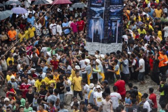 JOWAI, INDIA - JULY 14: People from the Pnar community march in a circle around a Rot as they