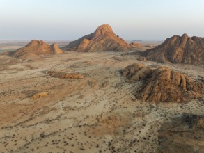 The isolated Spitzkoppe mountain (1728 m) majestically rises above the surrounding desert plains.