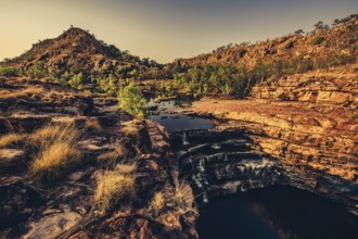 Bell Gorge waterfall, a body of water in north-west Australia in the Kimberley. Sunrise in the