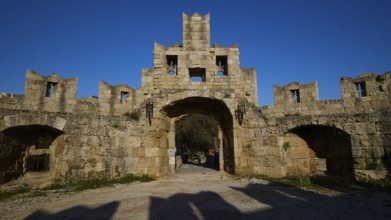 St Paul's Gate, Medieval stone castle gate under a clear blue sky, harbour area, Rhodes Town,