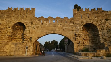 Arsenal gate, Rhodes city wall, Historic stone city gate in evening light, Harbour area, Rhodes