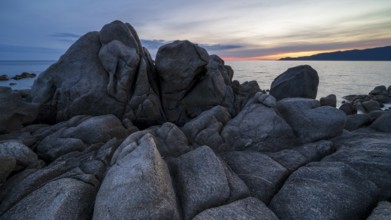 Sunset, rocky coast near Porto Pollo, Corsica, France