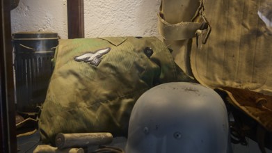 Display case with military equipment such as helmets and insignia, War Museum, Military Museum,