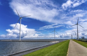 Strekdammen Wind Farm, wind farm at the seaport of Eemshaven in the Netherlands, left, built on