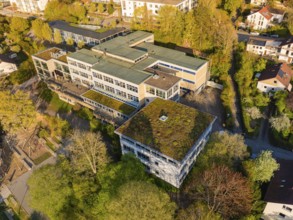 Modern building with green roof, surrounded by trees in an urban environment, Nagold, Black Forest,