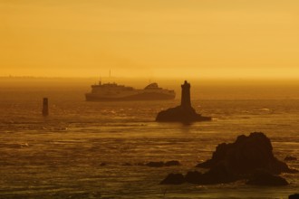 Phare de la Vieille lighthouse and ferryboat at sunset, Pointe du Raz, Cap Sizun, Finistere
