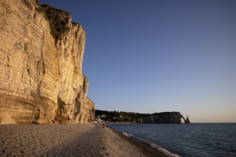 People on the beach, pebble beach, rock arch Falaise or Porte d'Aval, rock needle Aiguille,