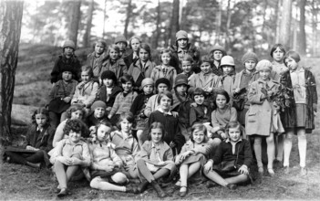 Group of children, 1920s, A large group of children sitting and standing in the forest, some in