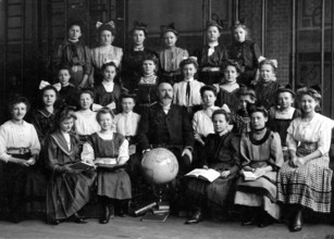 Girls class globe, 1930s, Group photo of a school class with teacher and globe, all in historical