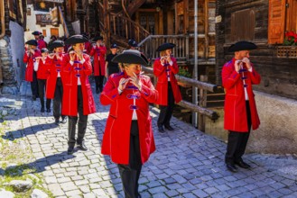 Pipers and drummers accompany the Corpus Christi procession, historic town centre, Grimentz, Val