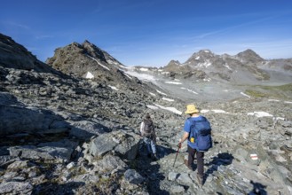 Mountaineer in rocky mountain landscape, hike between Col de Plafleuri and Col du Louvie, Valais
