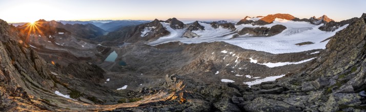 Panorama at sunrise with sun star, high mountain landscape, view of blue glacial lakes, mountain