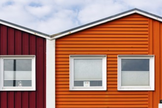 Colourful lobster huts, wooden façade with three windows, façade detail in the harbour, Heligoland,