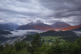 Marxenhöhe near Berchtesgaden with Watzmann view in the morning mist and alpenglow after the rain