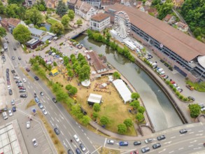 Aerial view of a Ferris wheel and a river in a summer town, 950 years of Calw, Calw parade, Black