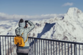 Woman in wintry surroundings in the Engadine in Switzerland