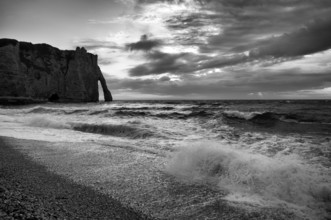 Surf in front of rock arch Falaise or Porte d'Aval, Étretat, sea, clouds, steep coast, cliffs,