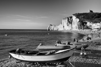 Rowing boat, boats lying on the beach, pebble beach, rock arch Falaise or Porte d'Amont, church