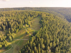 Overview of extensive slopes and forests in the soft light of day, Retro Freizeitpark Poppeltal