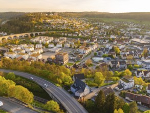 Aerial view of town with viaduct, houses and green hills, Nagold, Black Forest, Germany