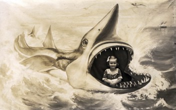 Girl posing for a photo in the painted mouth of a shark. Kitsch. ca. 1920s, location unknown