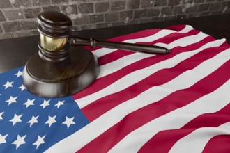 American flag and wooden gavel resting on desk