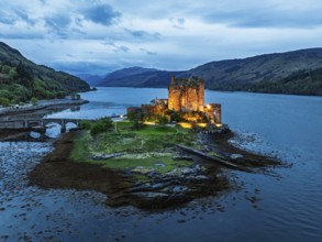 Night over Eilean Donan Castle and Loch Duich from a drone, Isle of Skye, Highlands, Scotland,
