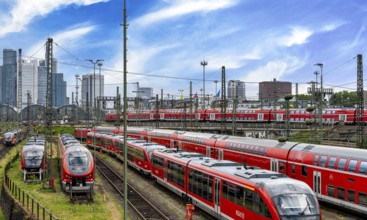 Bridge at Camberger Straße, Galluswarte, Deutsche Bahn, tracks and trains with the skyline of