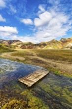 Volcanic landscape, colourful rhyolite mountains, ford, Cumulus, Landmannalaugar, remote hiking