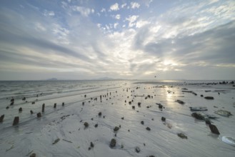 Structures in the sand at sunrise on Sivalai Beach, Koh Mook Island, Satun Province, Southern