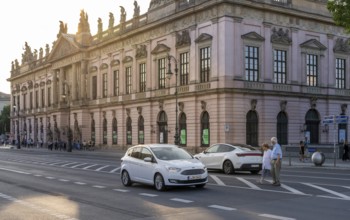 Road traffic and pedestrians on the carriageway in Berlin-Mitte, Unter den Linden, Berlin, Germany