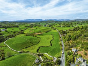 Farms and Fields over Road A591 from drone, Lake District, Cumbria, UK