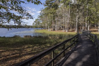 Wooden pedestrian bridge over part of Archusa Creek Lake at Archusa Creek Water Park near Quitman,
