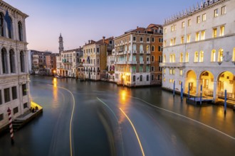 View of the Grand Canal at sunset, picturesque evening mood with illuminated palazzos on the canal