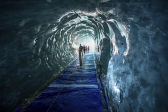 Artificial ice cave through the glacier ice, Mer de Glace, Montenvers, Chamonix, Haute-Savoie,