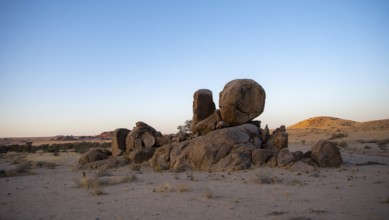 Round stacked rocks, desert landscape at sunset, Erongo, Damaraland, Namibia