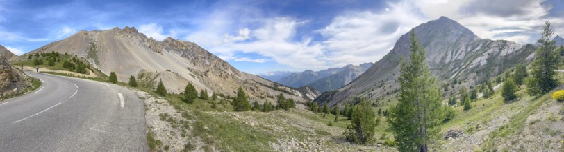 Panoramic view with left last bend of southern ramp southern ascent descent mountain road alpine