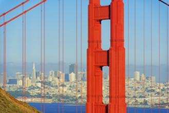 View of Golden Gate Bridge and financial district in the distance, San Francisco, California, USA